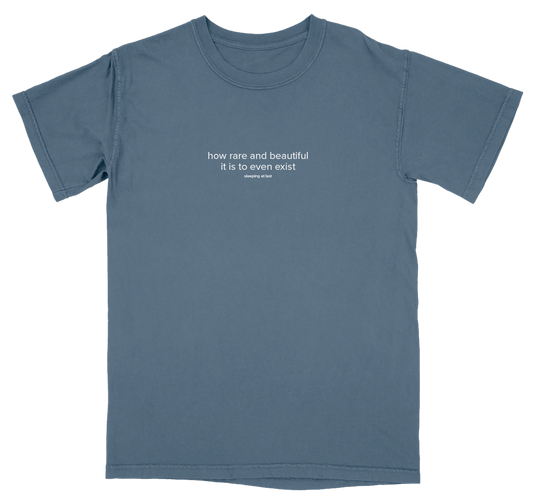 Blue t-shirt with white text on a white background